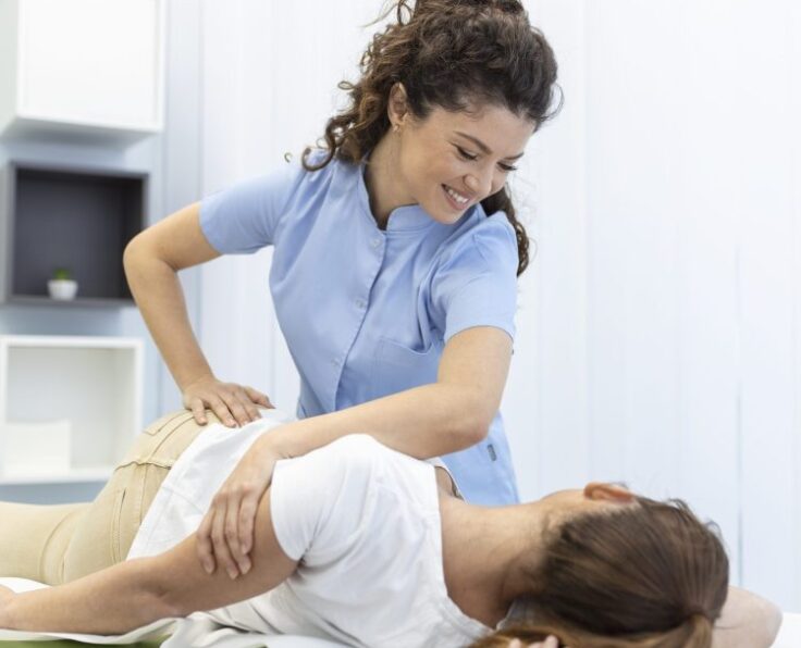 young-woman-doctor-chiropractor-osteopath-fixing-lying-womans-back-with-hands-movements-during-visit-manual-therapy-clinic-professional-chiropractor-during-work-scaled-3jcmer30kvaobvbhmbw0zu